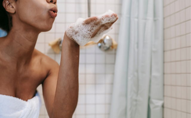 Black Girl with shampoo in hand