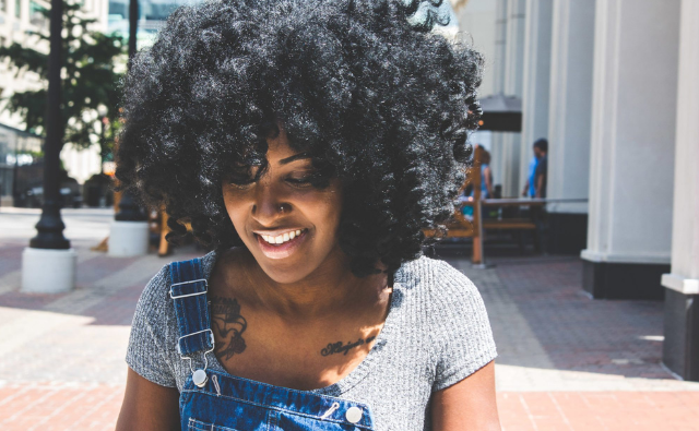 black woman rocking bantu knot out hairstyle