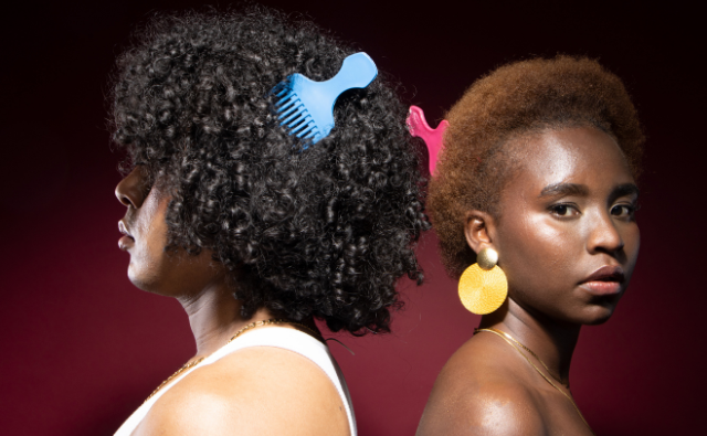 People of color with natural hair adorned with afro piks