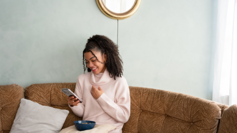Black girl looking at her phone